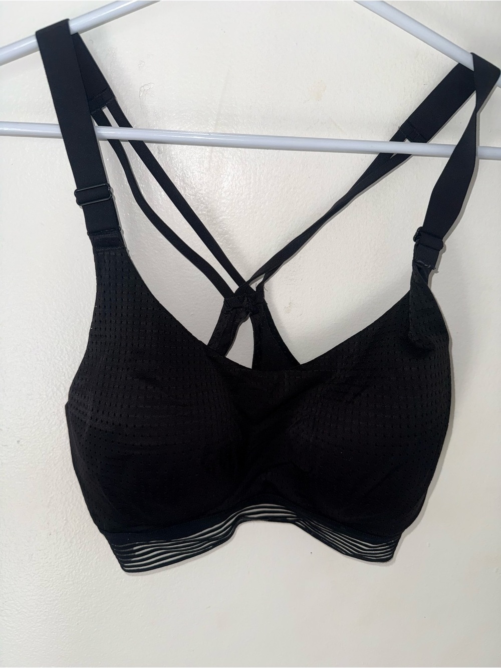 Supportive Black Strappy Sports Bra with Mesh Hem